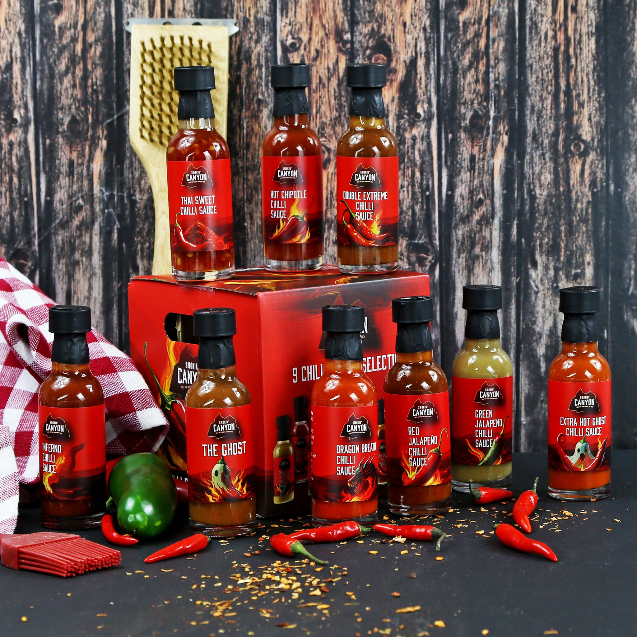 A selection of 9 chilli sauces displayed in a lifestyle setting