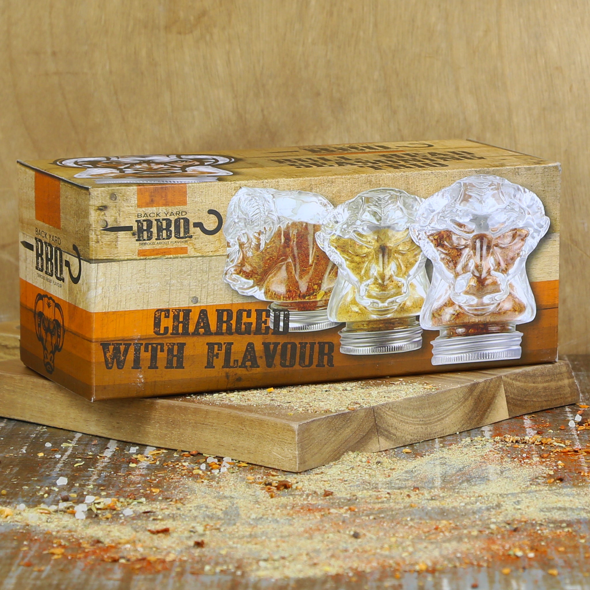 A BBQ gift box containing 3 glass bull shaped seasoning jars