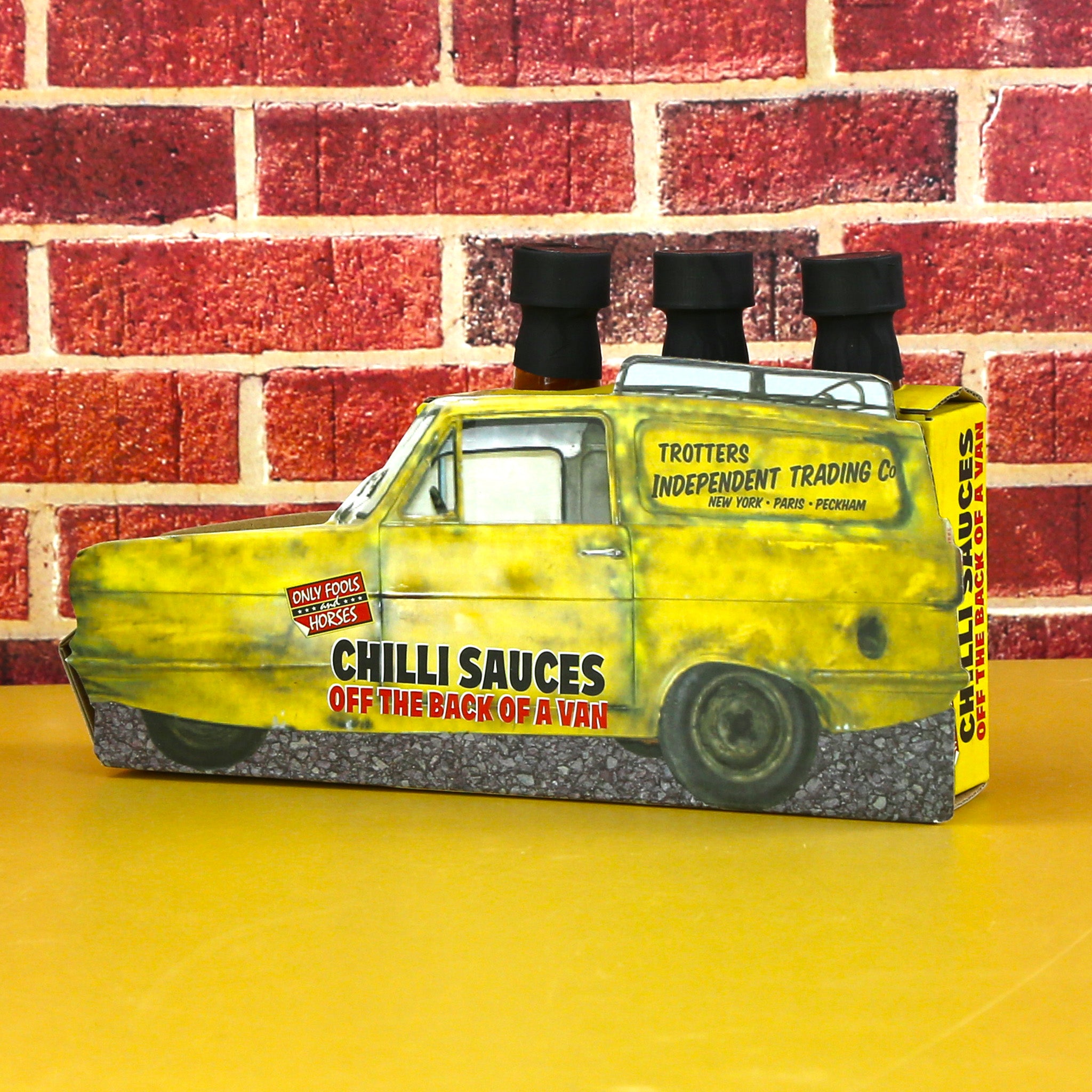 Three hot chilli sauces with Only Fools and Horsed styling. Presented in a box shaped as DelBoy's van