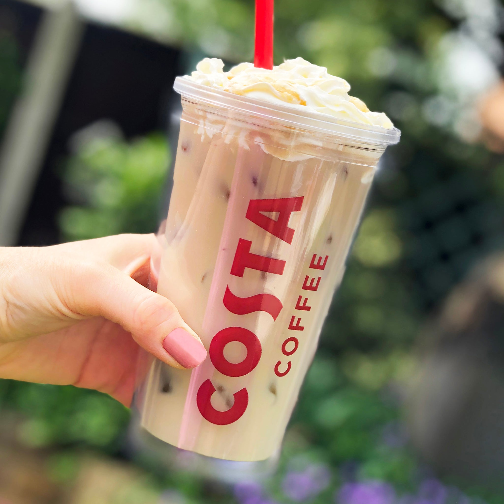Costa branded iced coffee cup with straw