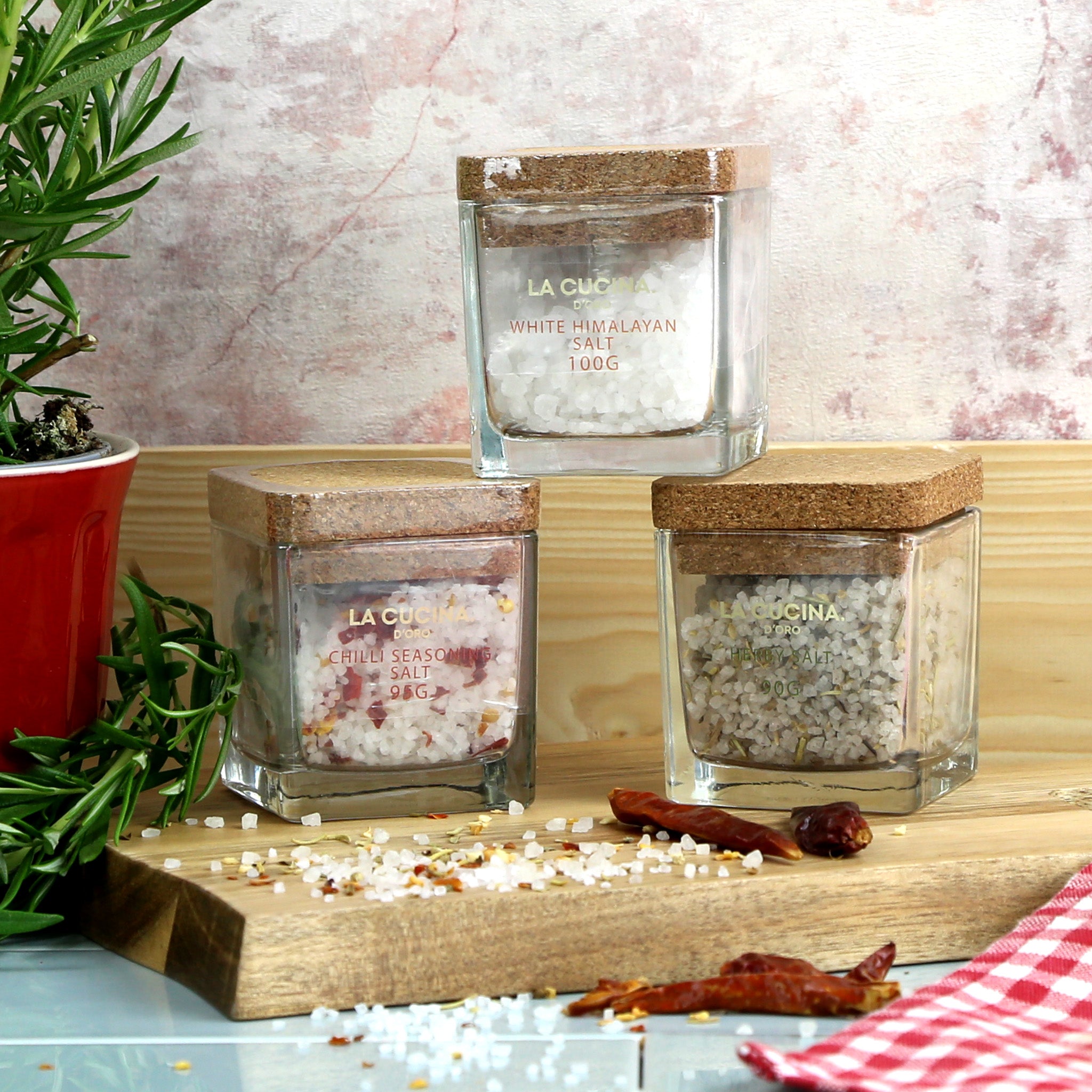 A trio of flavoured rock salts presented in glass pinch pots with cork lids