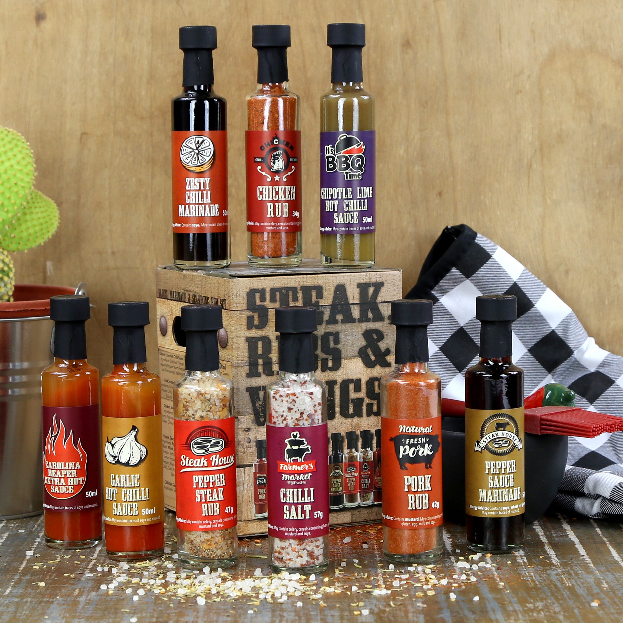 A bbq gift box with 9 assorted rubs, marinades and salt in bottles